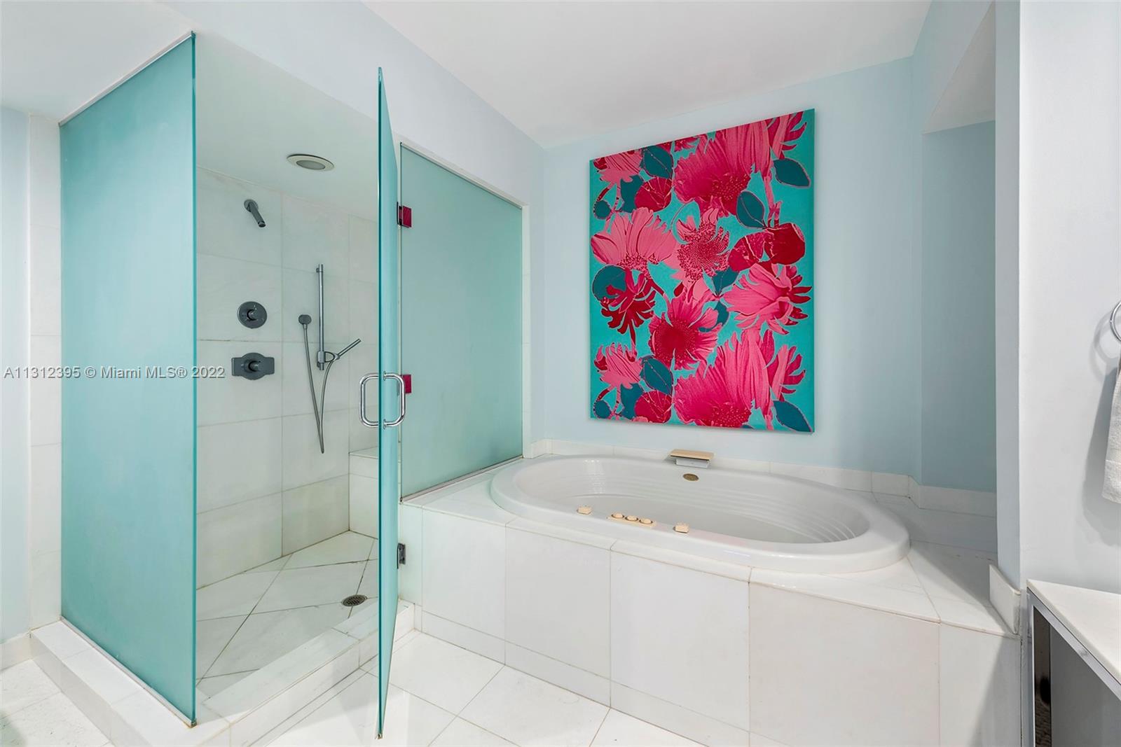 450 Alton Road, Unit 3010 Miami Beach, FL 33139 - Photo 20 of 66 a bathroom with a bathtub and shower