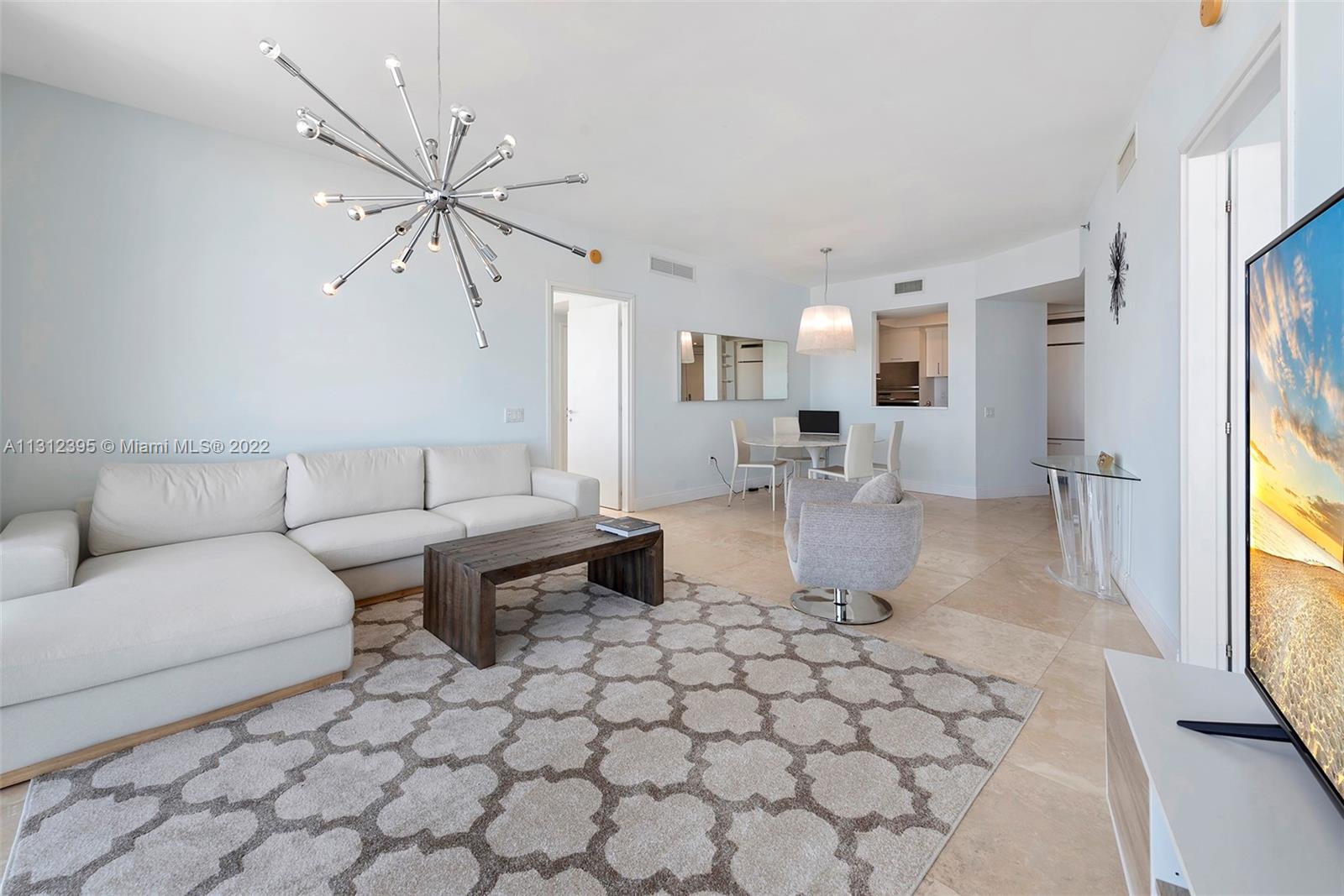 450 Alton Road, Unit 3010 Miami Beach, FL 33139 - Photo 28 of 66 a living room with furniture and a large window
