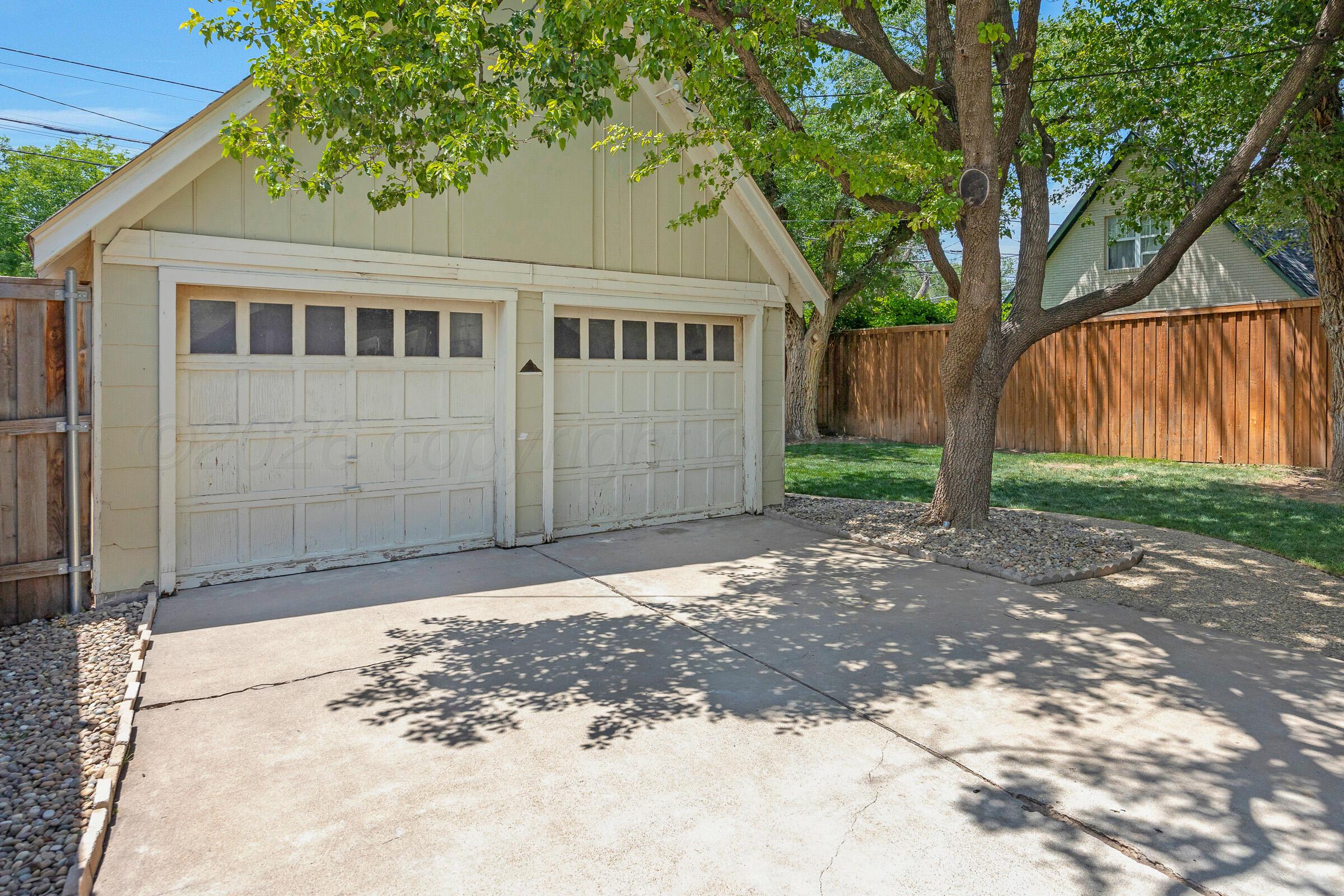 2102 South Hayden Street Amarillo, TX 79109 - Photo 44 of 44 a front view of a house with a yard
