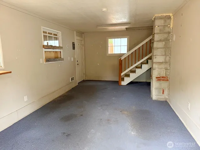 a view of an entryway with wooden floor