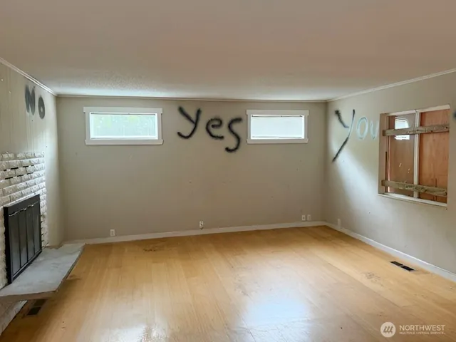 a view of room with window and fireplace