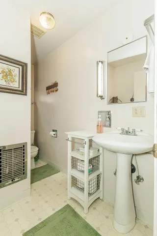 a bathroom with a sink a mirror and a shower