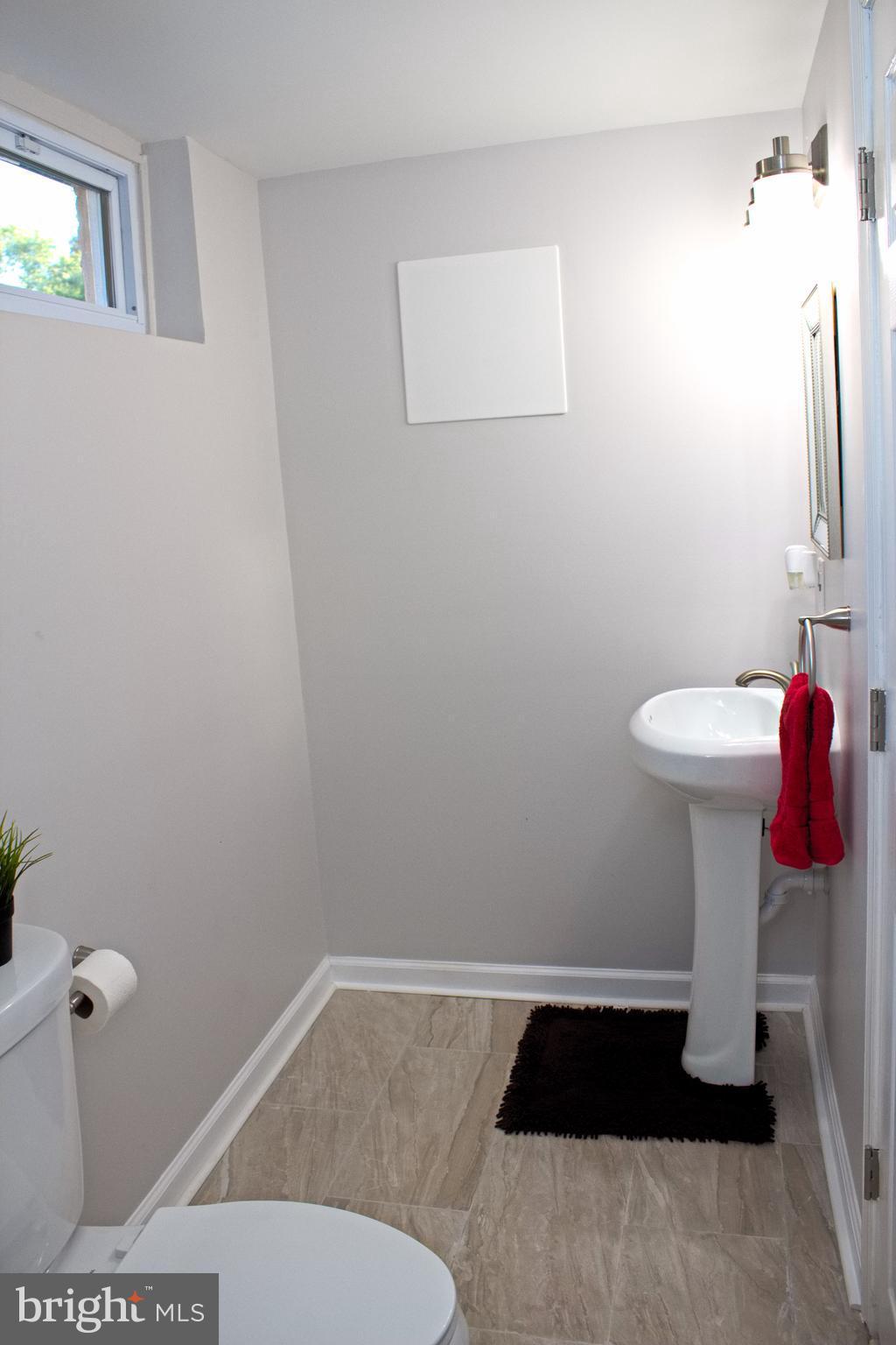 315 Highfalcon Road Reisterstown, MD 21136 - Photo 29 of 30 a bathroom with a sink toilet and a mirror