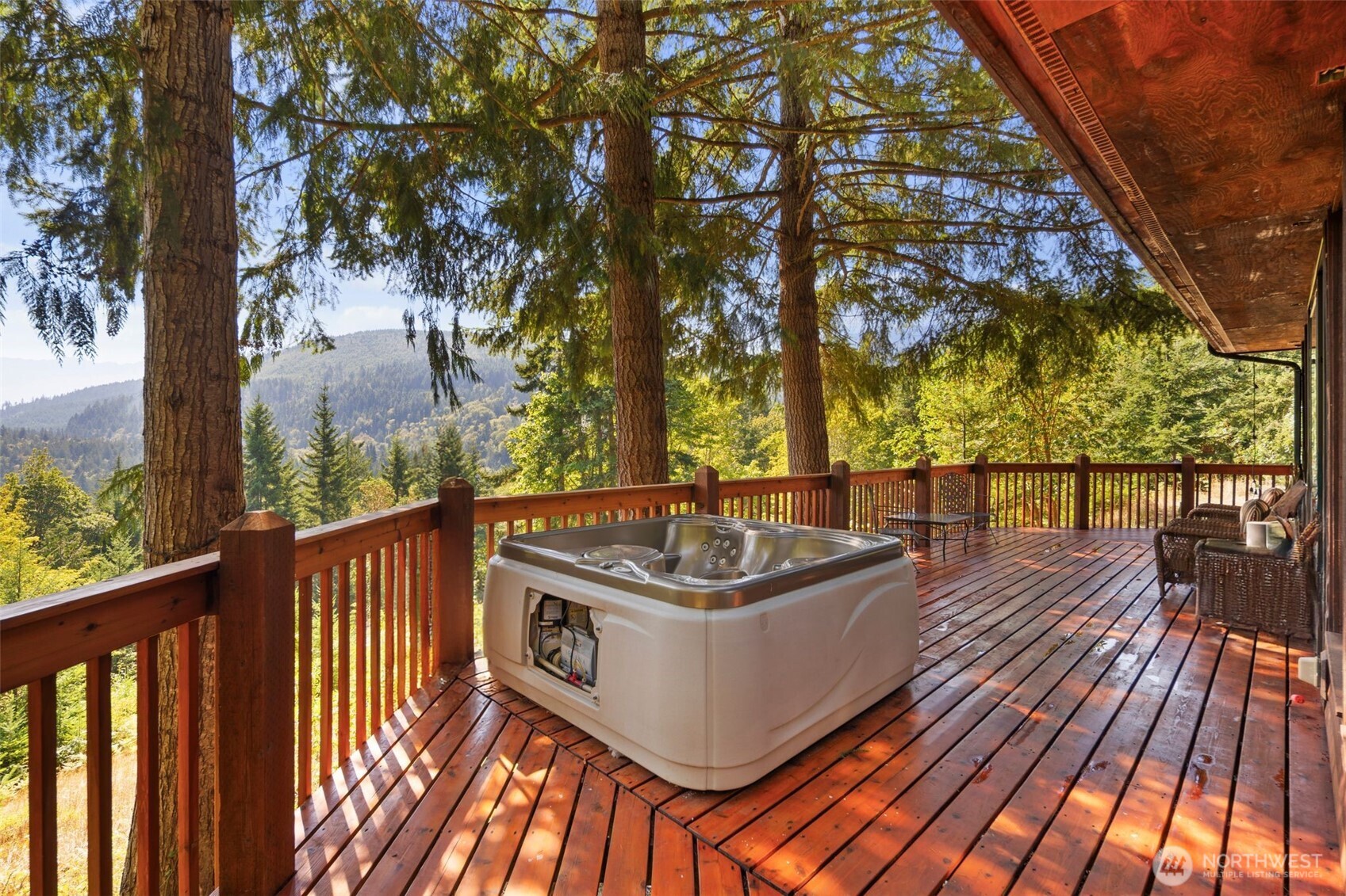 428 Eagle Ridge Road Port Angeles, WA 98363 - Photo 16 of 40 a view of a balcony with wooden floor and fence