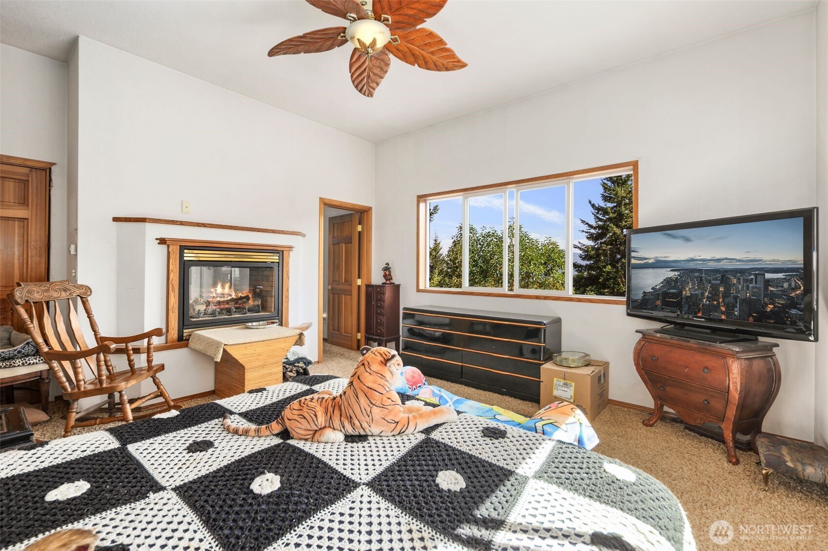 428 Eagle Ridge Road Port Angeles, WA 98363 - Photo 18 of 40 a living room with furniture a rug and a floor to ceiling window