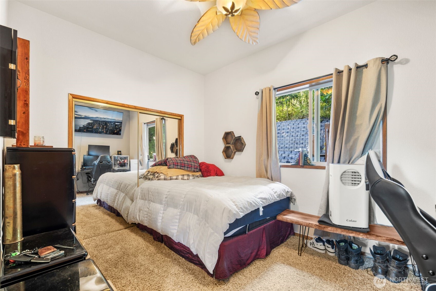428 Eagle Ridge Road Port Angeles, WA 98363 - Photo 26 of 40 a bedroom with a bed window and a flat screen tv
