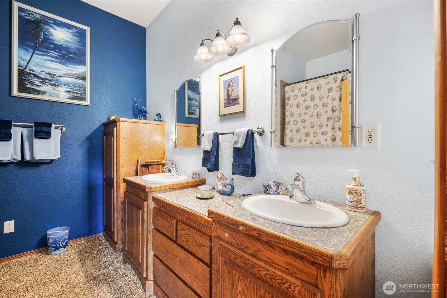 428 Eagle Ridge Road Port Angeles, WA 98363 - Photo 27 of 40 a bathroom with a sink double vanity and a mirror