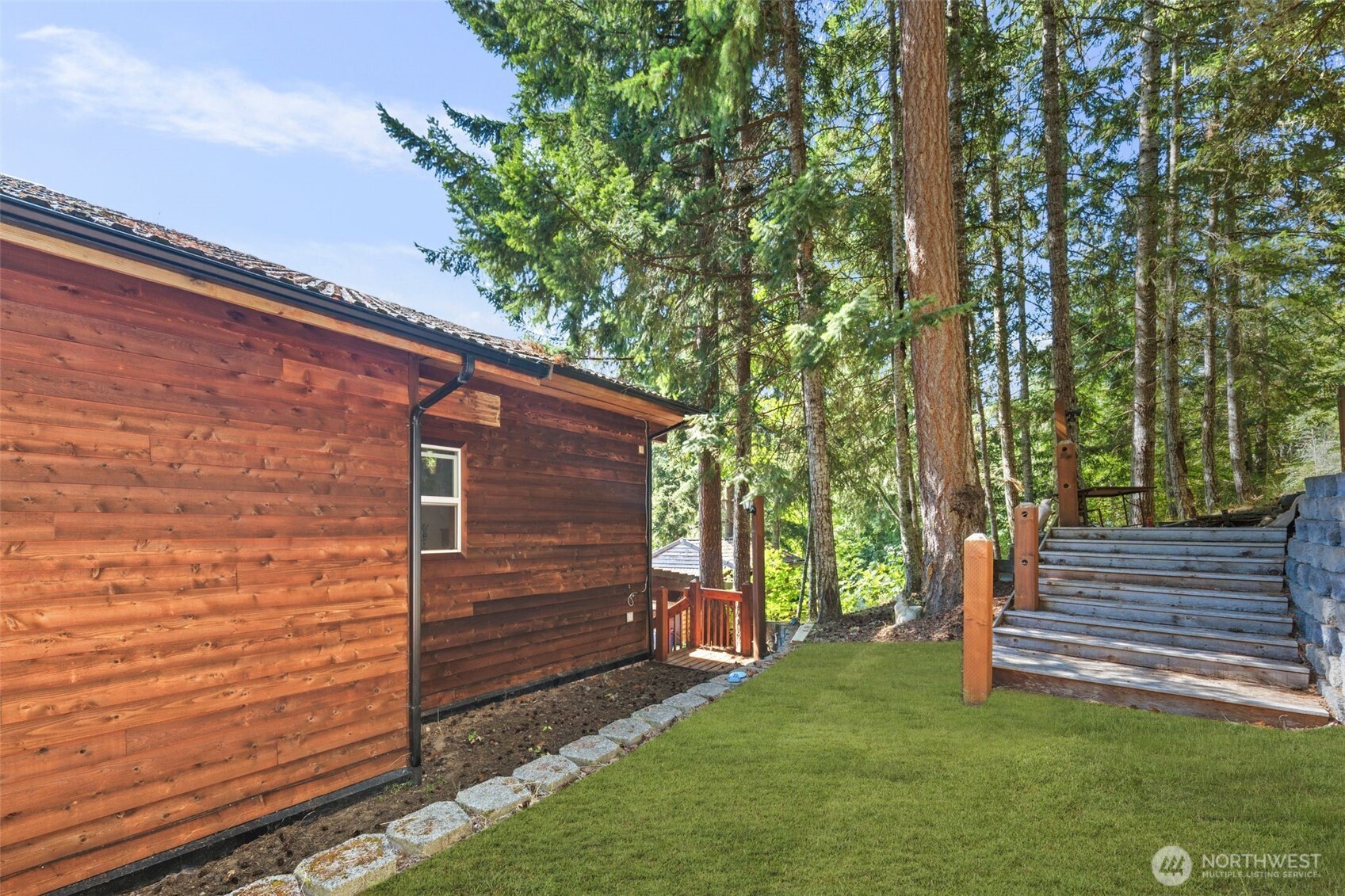 428 Eagle Ridge Road Port Angeles, WA 98363 - Photo 37 of 40 a front view of a house with a garden