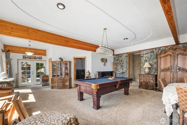 a living room with furniture a table and chairs