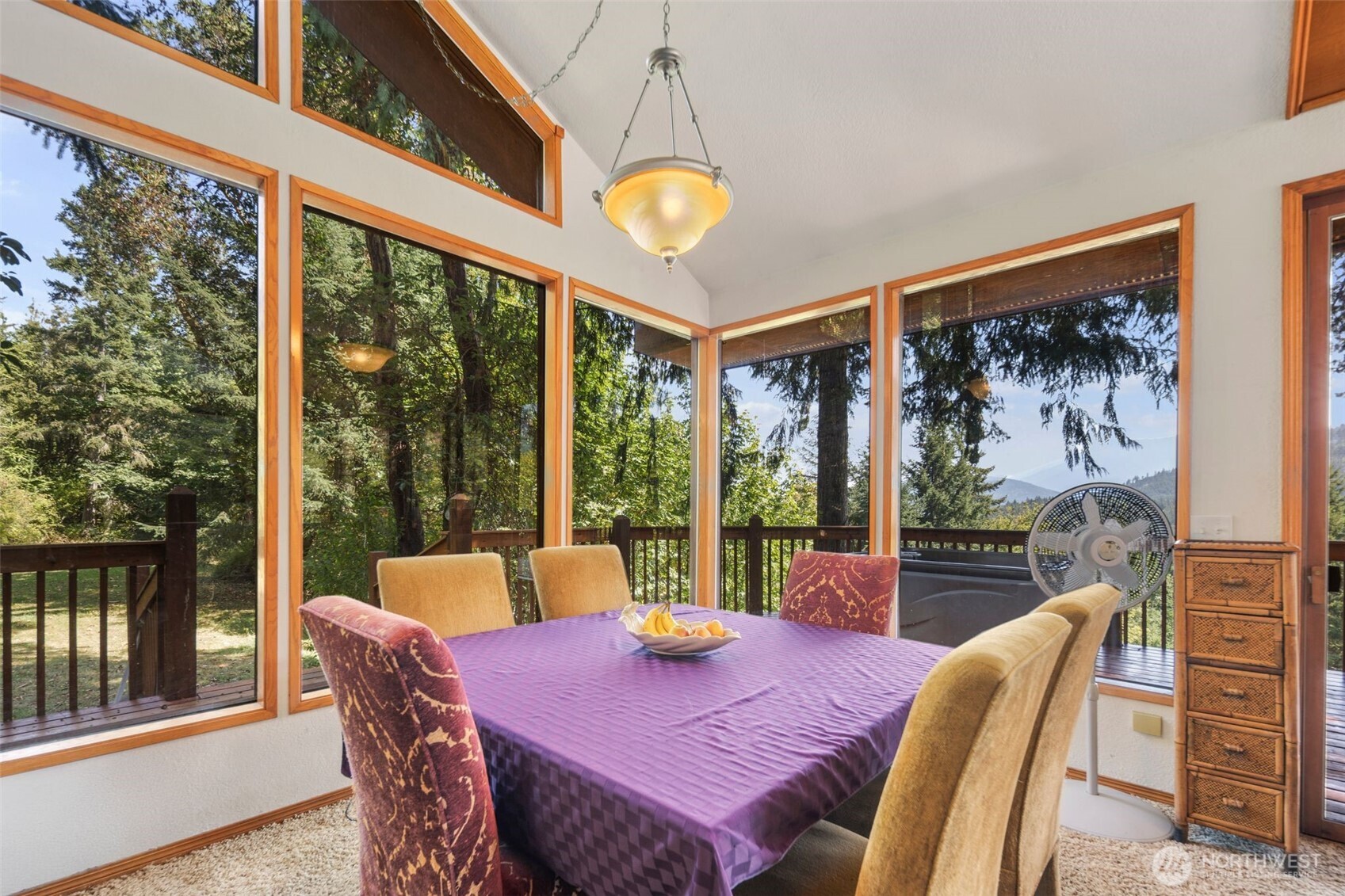 428 Eagle Ridge Road Port Angeles, WA 98363 - Photo 10 of 40 a view of a dining room with furniture a chandelier and wooden floor