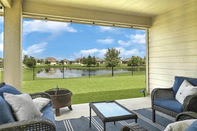 a view of a patio with couches chairs and a table