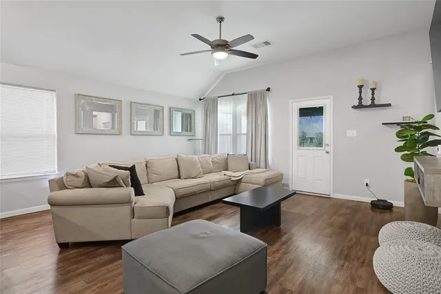 a living room with furniture and a large window