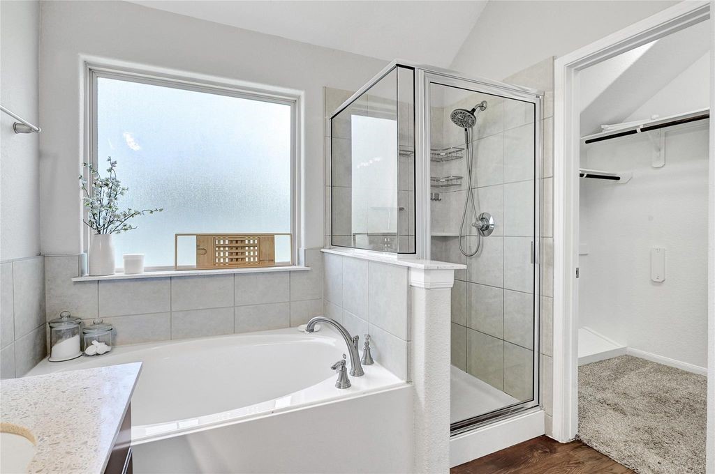 5422 Still Creek Ranch Drive Richmond, TX 77469 - Photo 14 of 28 a bathroom with a tub and a shower