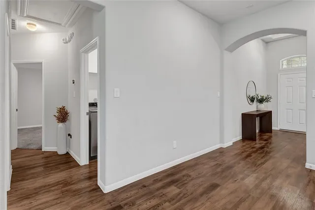 a view of a livingroom with wooden floor
