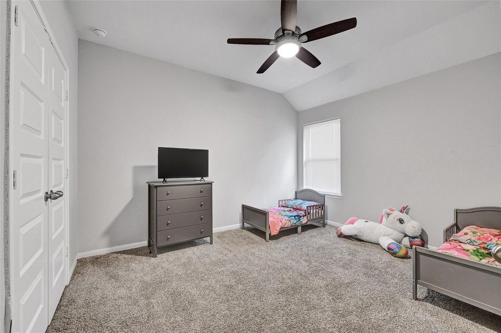 5422 Still Creek Ranch Drive Richmond, TX 77469 - Photo 18 of 28 a view of a livingroom with toys