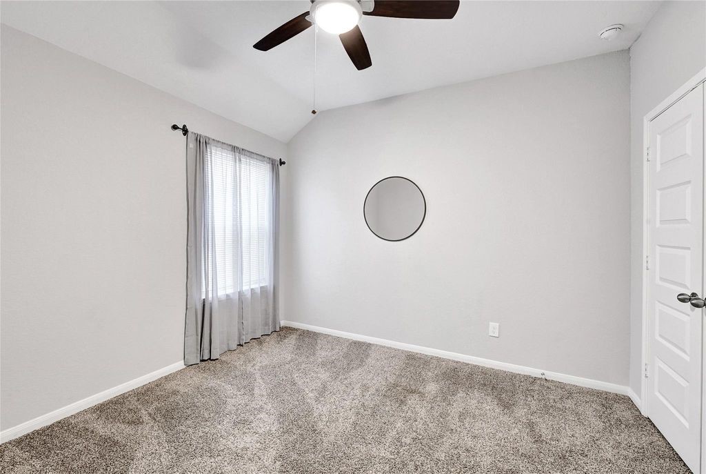 5422 Still Creek Ranch Drive Richmond, TX 77469 - Photo 19 of 28 an empty room with a window
