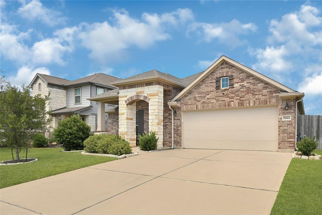 5422 Still Creek Ranch Drive Richmond, TX 77469 - Photo 2 of 28 a front view of a house with garden