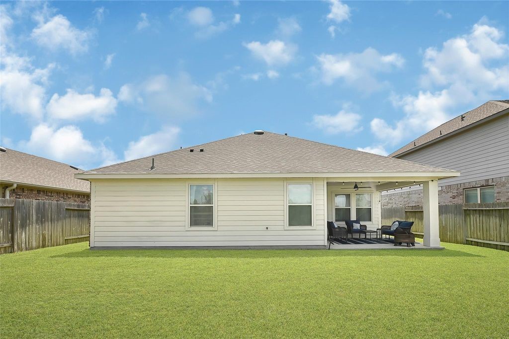 5422 Still Creek Ranch Drive Richmond, TX 77469 - Photo 23 of 28 a front view of house with yard barbeque and outdoor seating
