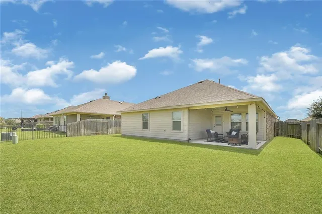 a view of a lake with houses in the back