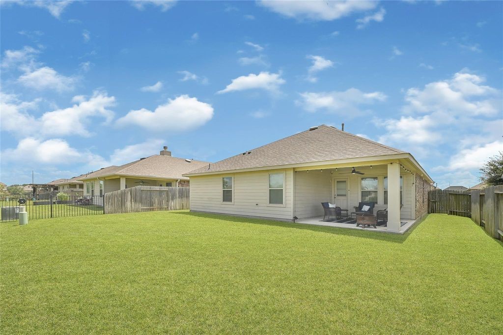 5422 Still Creek Ranch Drive Richmond, TX 77469 - Photo 24 of 28 a view of a house with a yard and potted plants