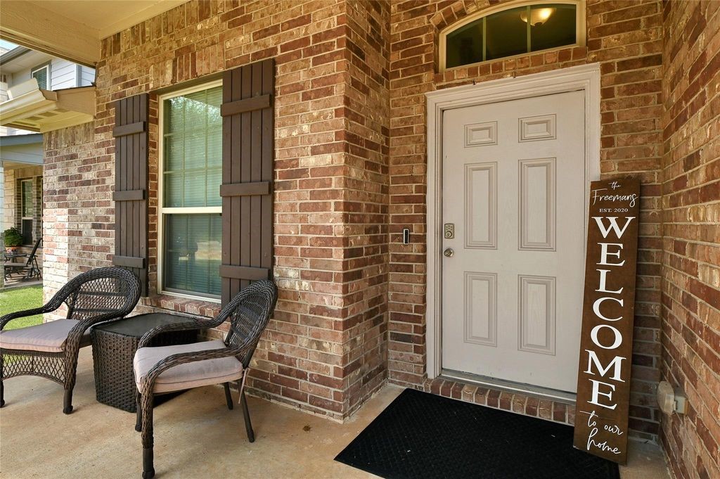 5422 Still Creek Ranch Drive Richmond, TX 77469 - Photo 4 of 28 a view of a door with a bench and a window