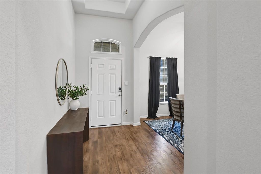 5422 Still Creek Ranch Drive Richmond, TX 77469 - Photo 6 of 28 wooden floor with a mirror