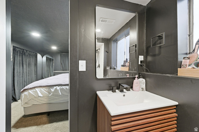 2323 North 720 West Clinton, UT 84015 - Photo 22 of 34 Ensuite bathroom with vanity, a textured ceiling, and recessed lighting