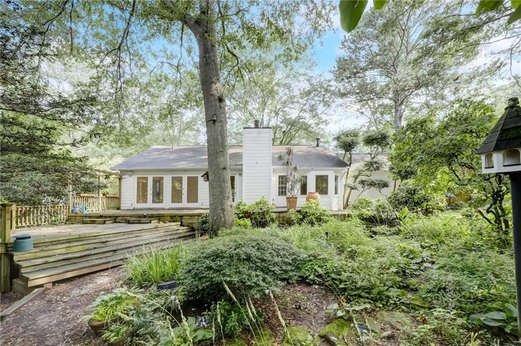 6974 Cedar Drive Riverdale, GA 30296 - Photo 1 of 1 a front view of a house with a yard