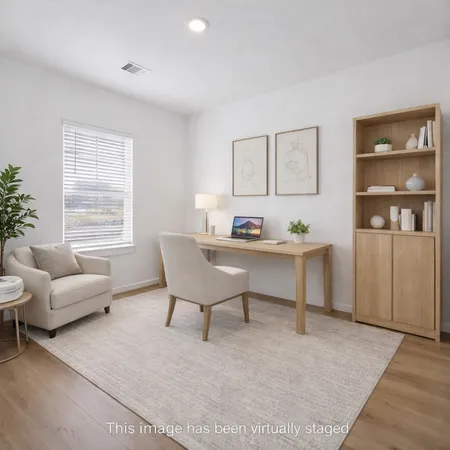 a living room with furniture kitchen view and a table