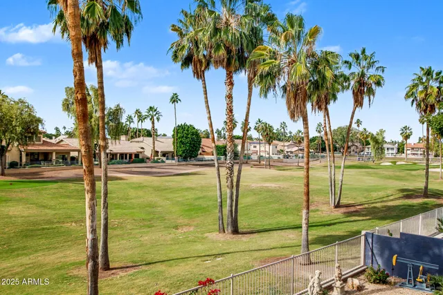 a view of sitting area with chairs and floor to ceiling window