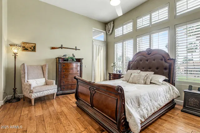 a bedroom with a bed and a potted plant