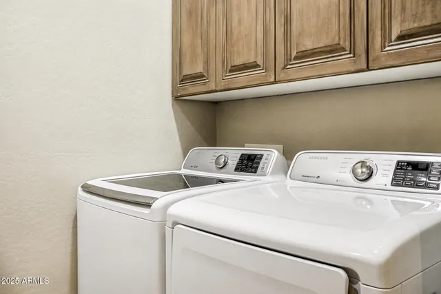 a bedroom with a bed and glass wall