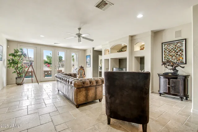 a living room with furniture a dining table and kitchen view