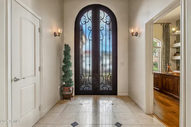 a dining room with furniture a fireplace and wooden floor
