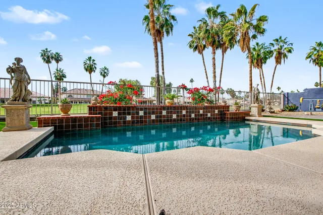 a view of a swimming pool with a patio