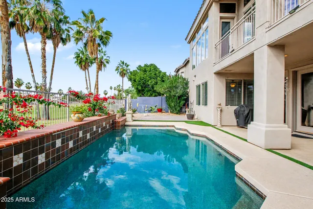 a view of a swimming pool with a lounge chair