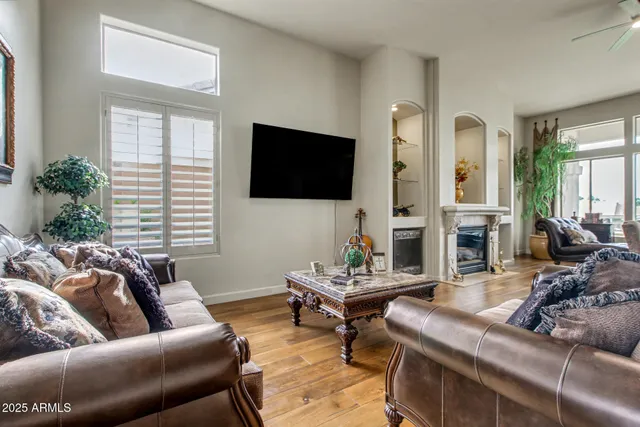 a living room with furniture couches and a flat screen tv