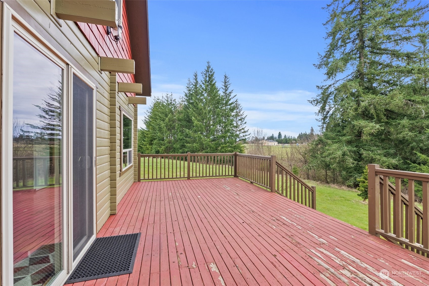 658 Spencer Road Toledo, WA 98591 - Photo 23 of 33 a view of a balcony with wooden floor and fence