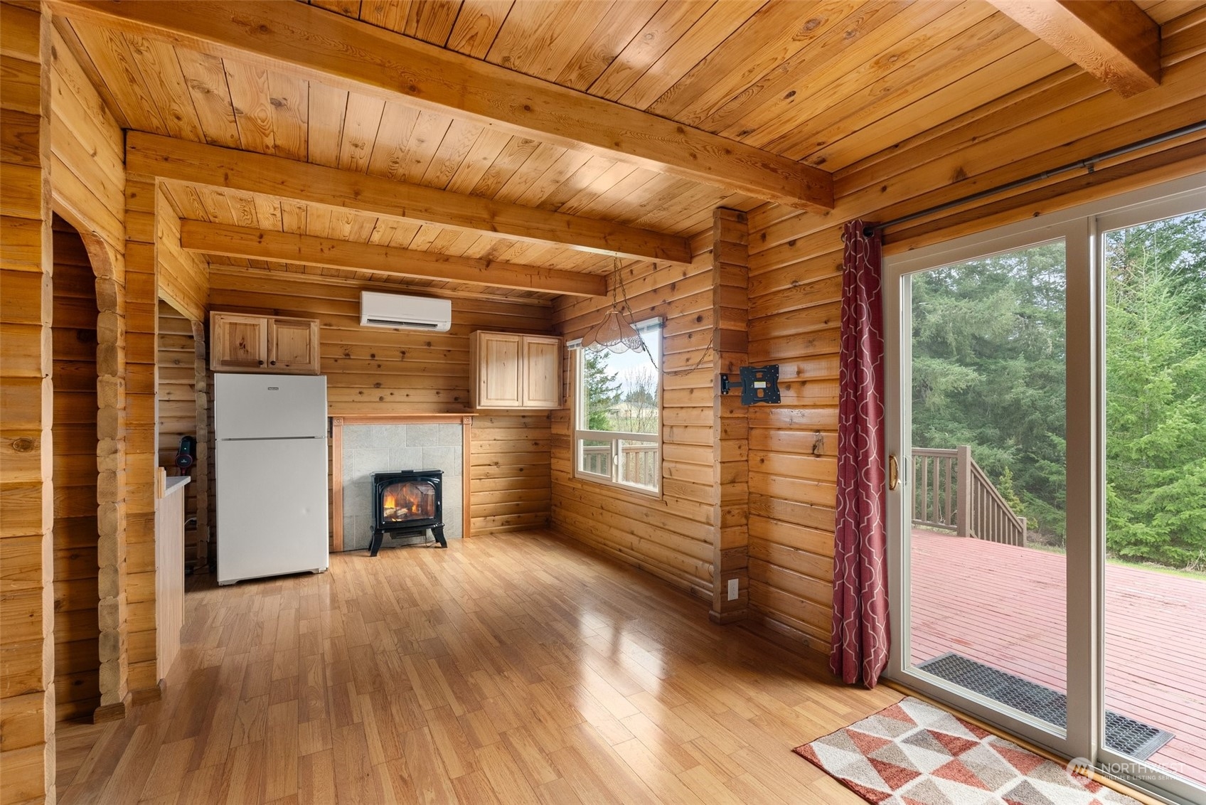 658 Spencer Road Toledo, WA 98591 - Photo 9 of 33 a view of empty room with wooden floor and fireplace