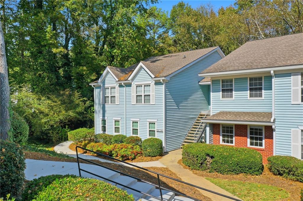 4053 Whitehall Way Alpharetta, GA 30004 - Photo 1 of 28 a front view of a house with a yard