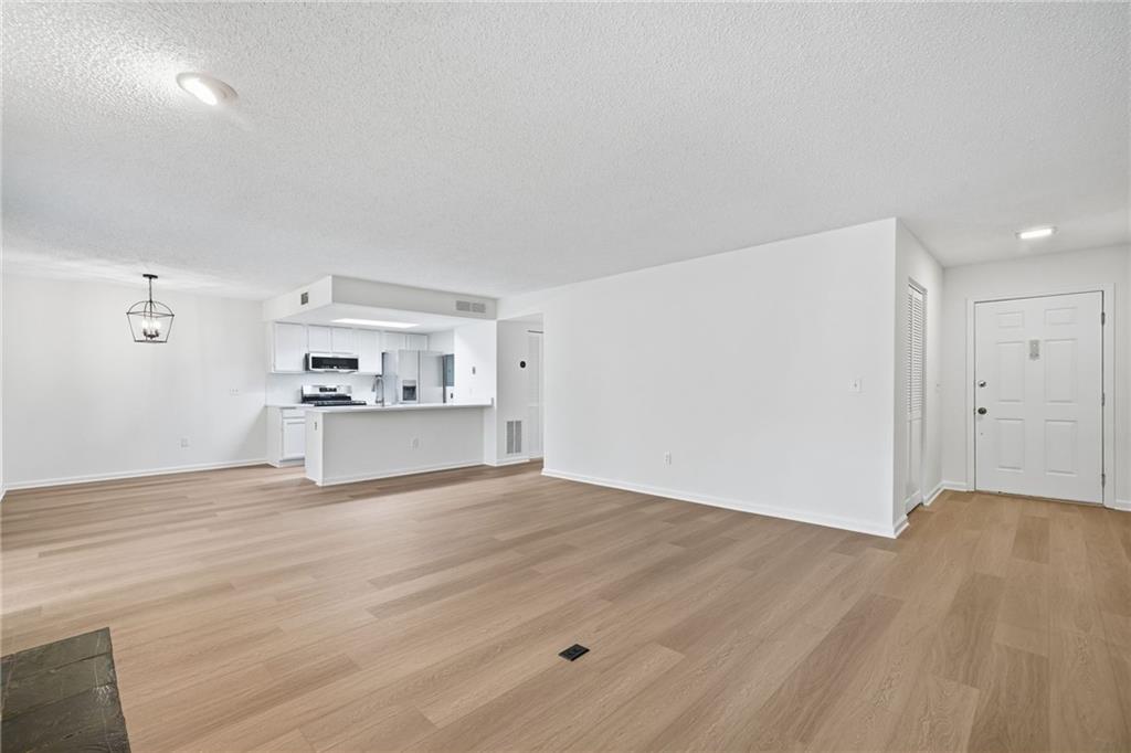 4053 Whitehall Way Alpharetta, GA 30004 - Photo 11 of 28 a view of a kitchen with wooden floor and a sink