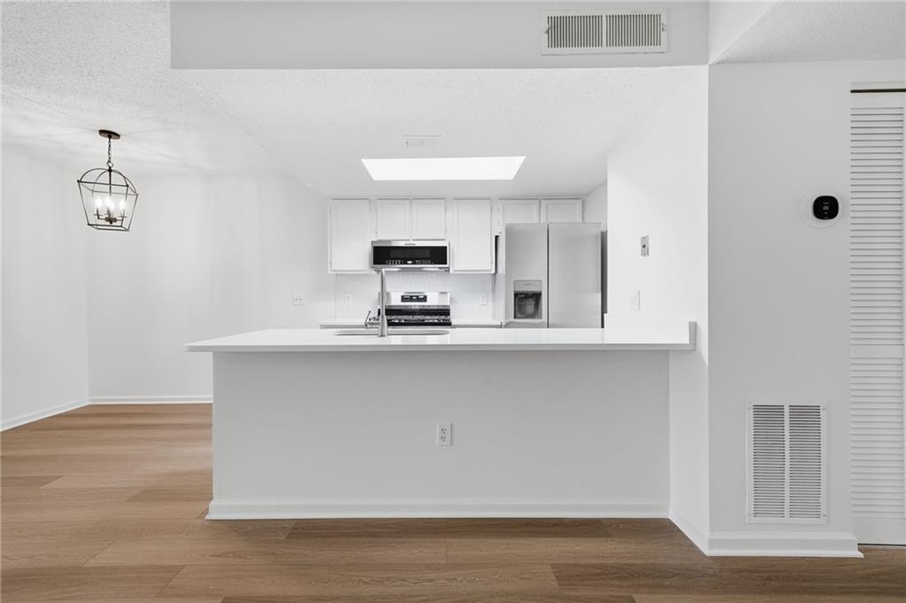 4053 Whitehall Way Alpharetta, GA 30004 - Photo 16 of 28 a bathroom with a sink and a mirror