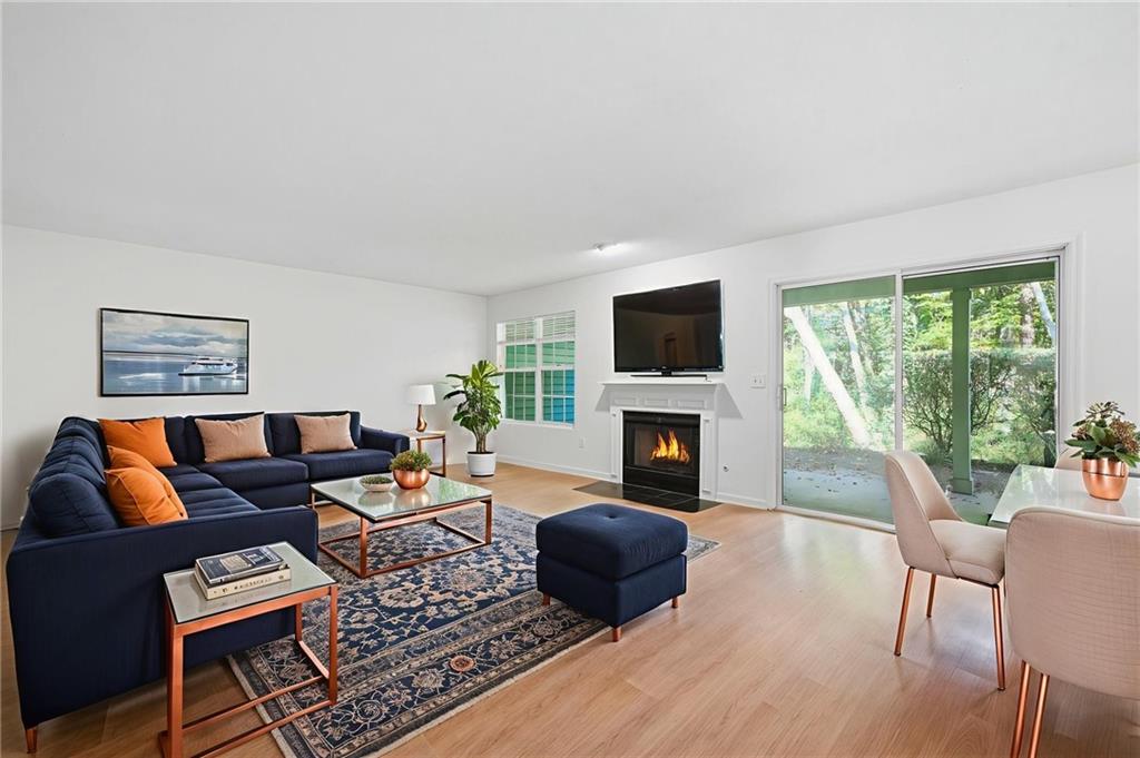 4053 Whitehall Way Alpharetta, GA 30004 - Photo 8 of 28 a living room with furniture and a fireplace