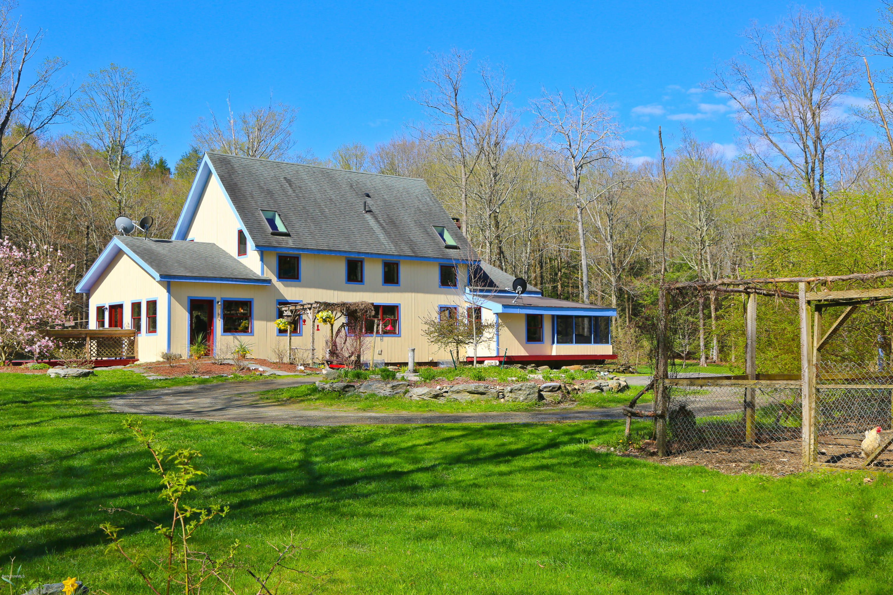 53 Maple Hill Road West Stockbridge, MA 01266 - Photo 3 of 22 a front view of a house with a garden