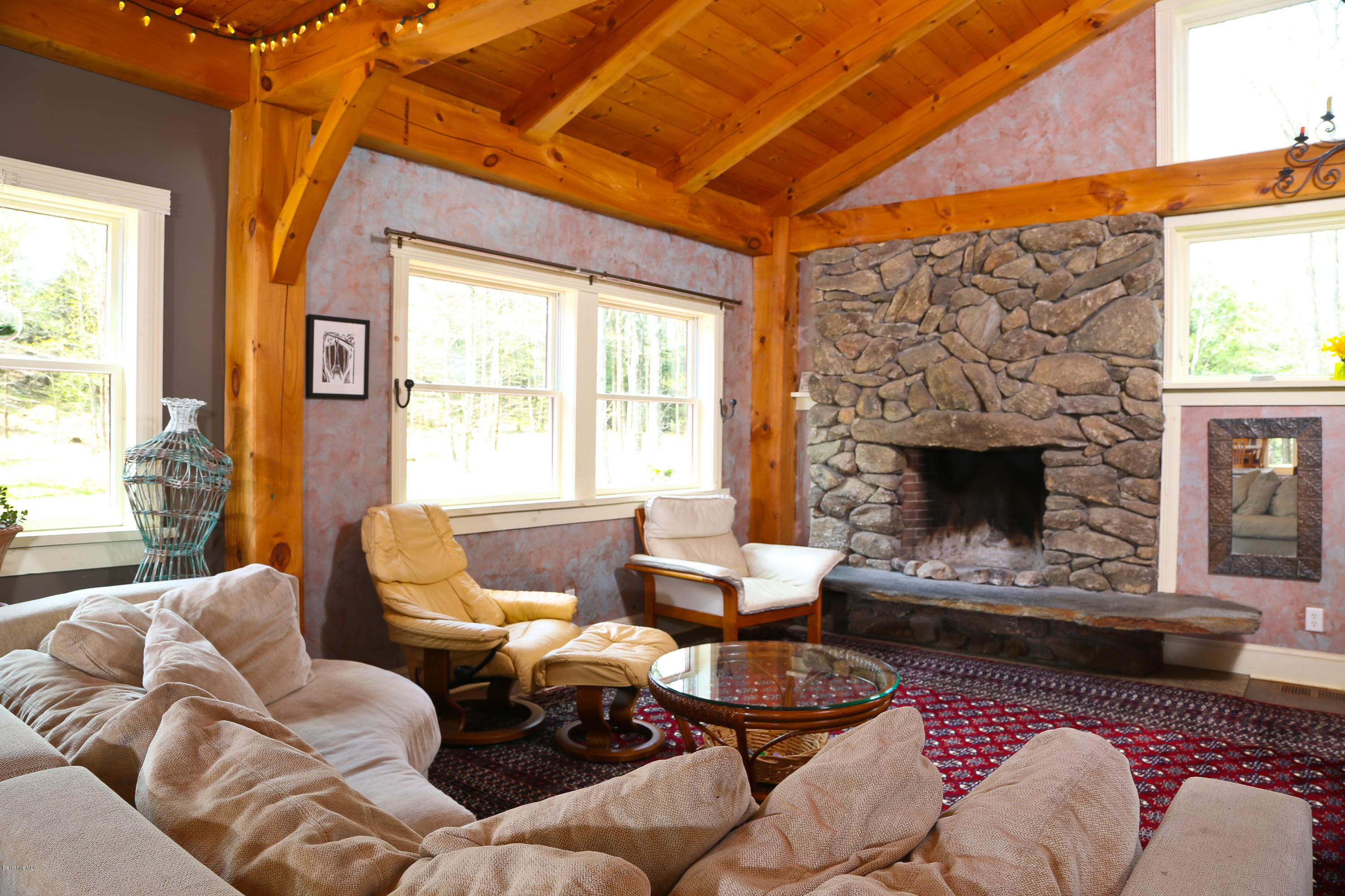 53 Maple Hill Road West Stockbridge, MA 01266 - Photo 10 of 22 a living room with furniture windows and a fireplace
