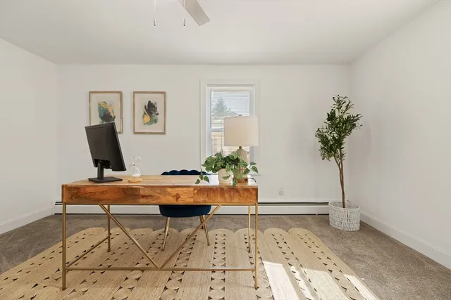 a room that has a table and a potted plant