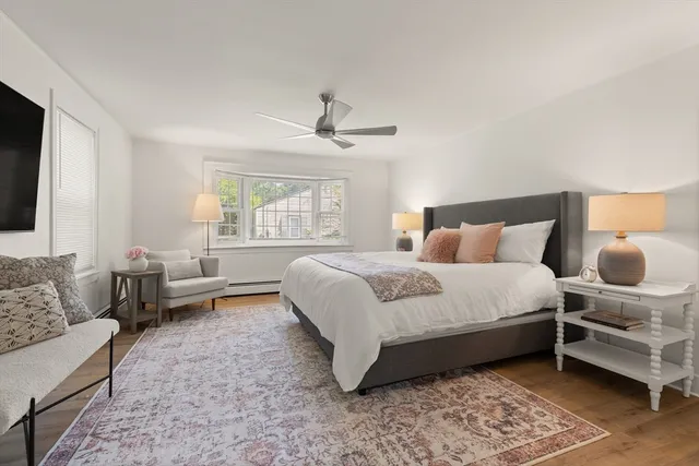 a bedroom with bed and window