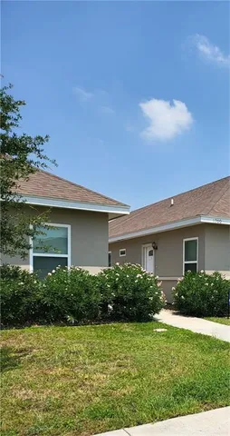 a house view with a garden space