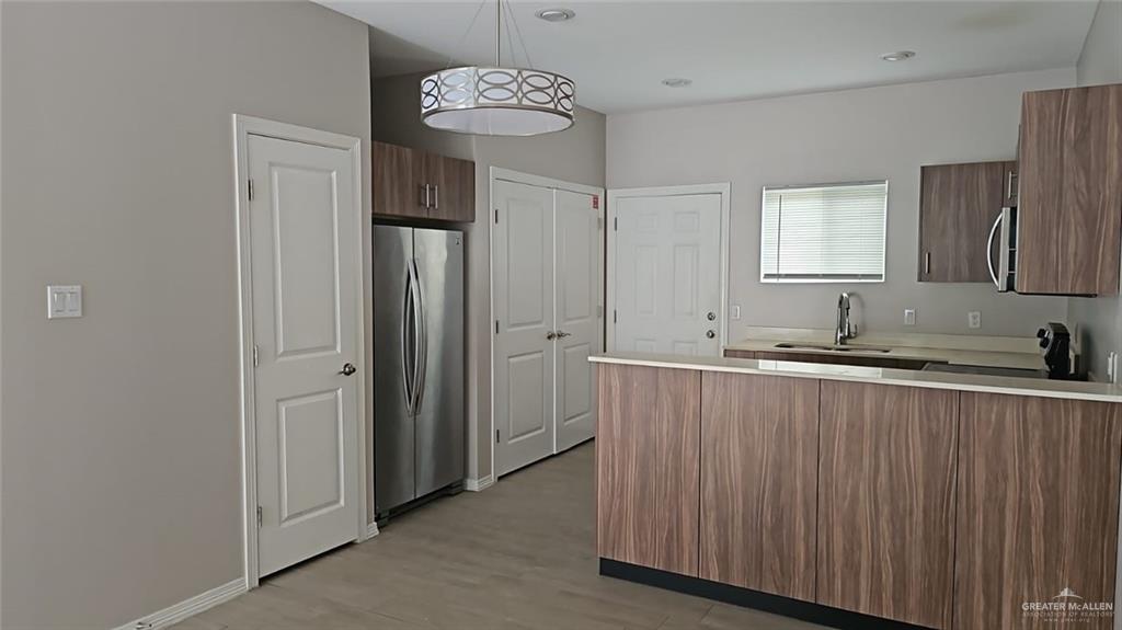 1900 Jackson Street, Unit 4 Weslaco, TX 78599 - Photo 4 of 15 a view of a kitchen from a hallway