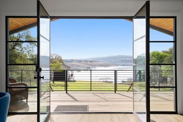 a view of a porch with a floor to ceiling windows